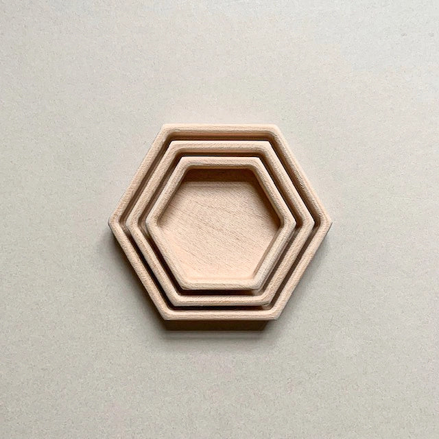 Beech wood nesting trays used for sensory play and color sorting