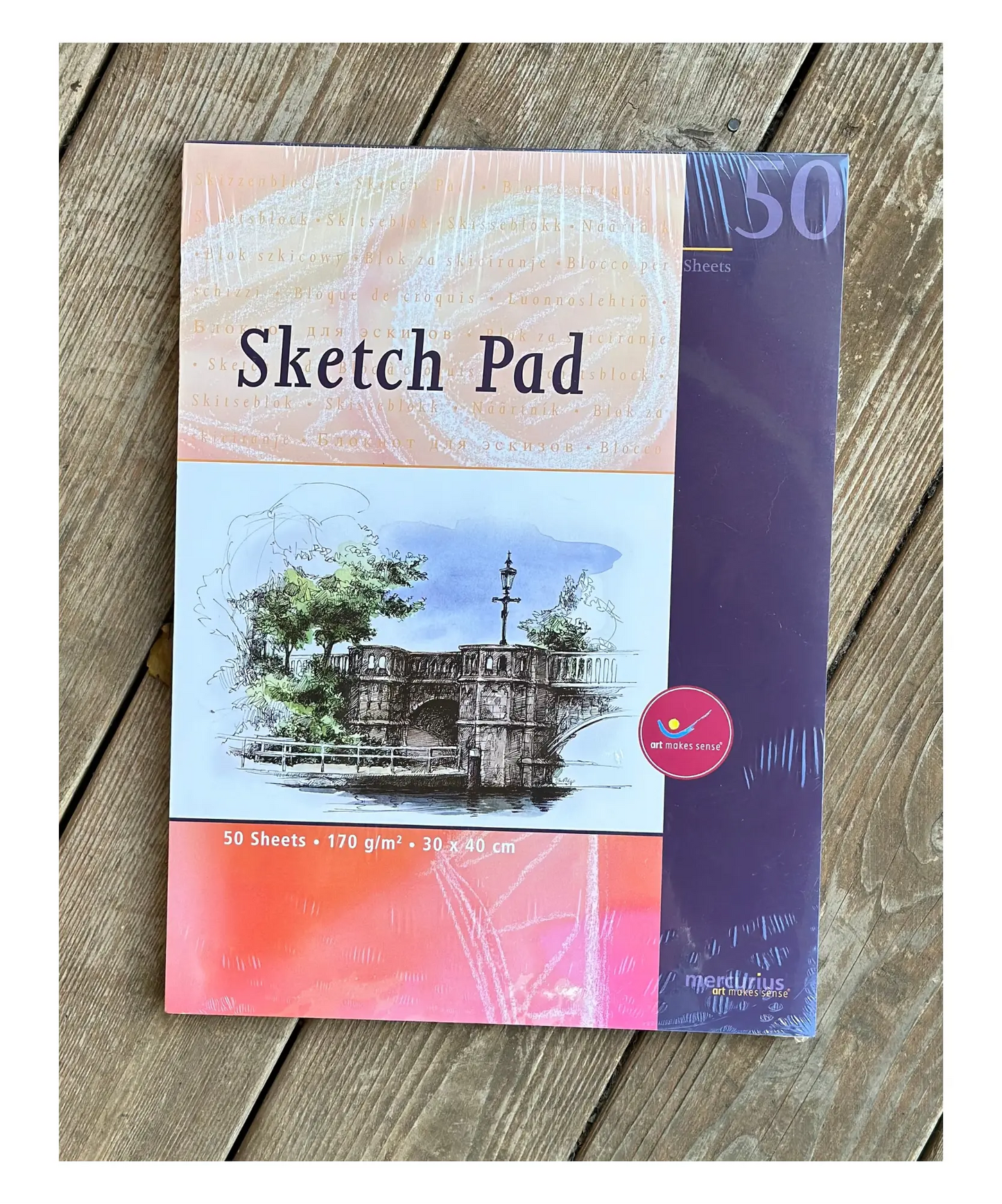 Mercurius Art Makes Sense Sketch Pad on a rustic wooden tabletop