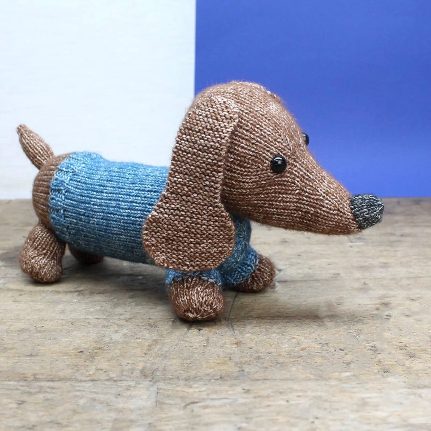 Close up dachshund from knitting craft kit soft brown and blue Scheepjes yarn - Alder & Alouette