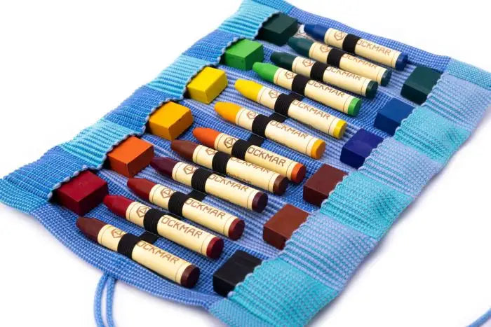 Three tone Blue crayon roll up case open to show crayons on white background