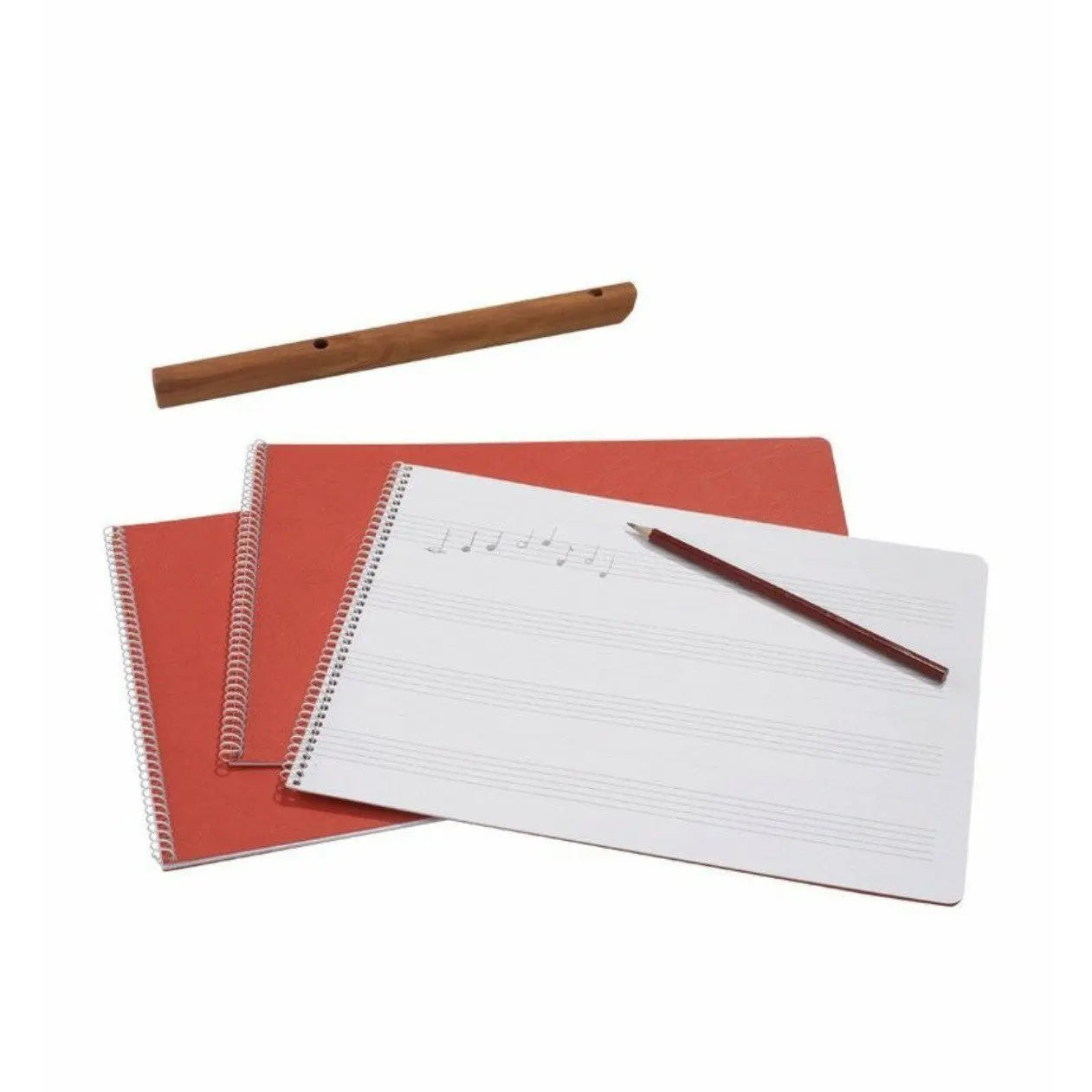 Red notebook and white spiral-bound blank music staves with a flute in the background
