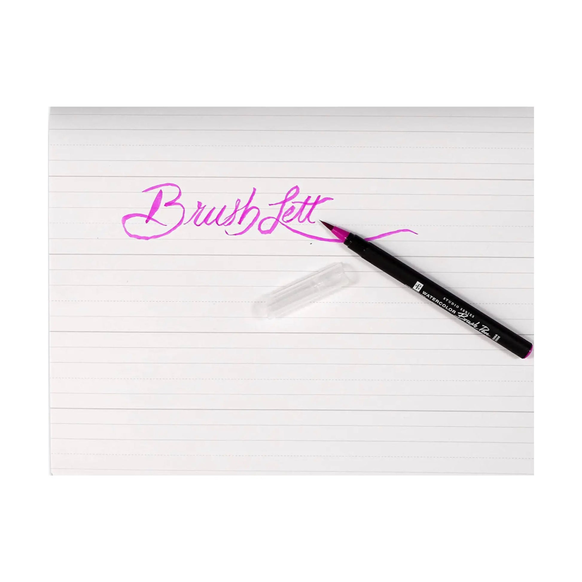 Watercolor Brush Pen with pink ink on lined paper displaying 'Brush Lett' text