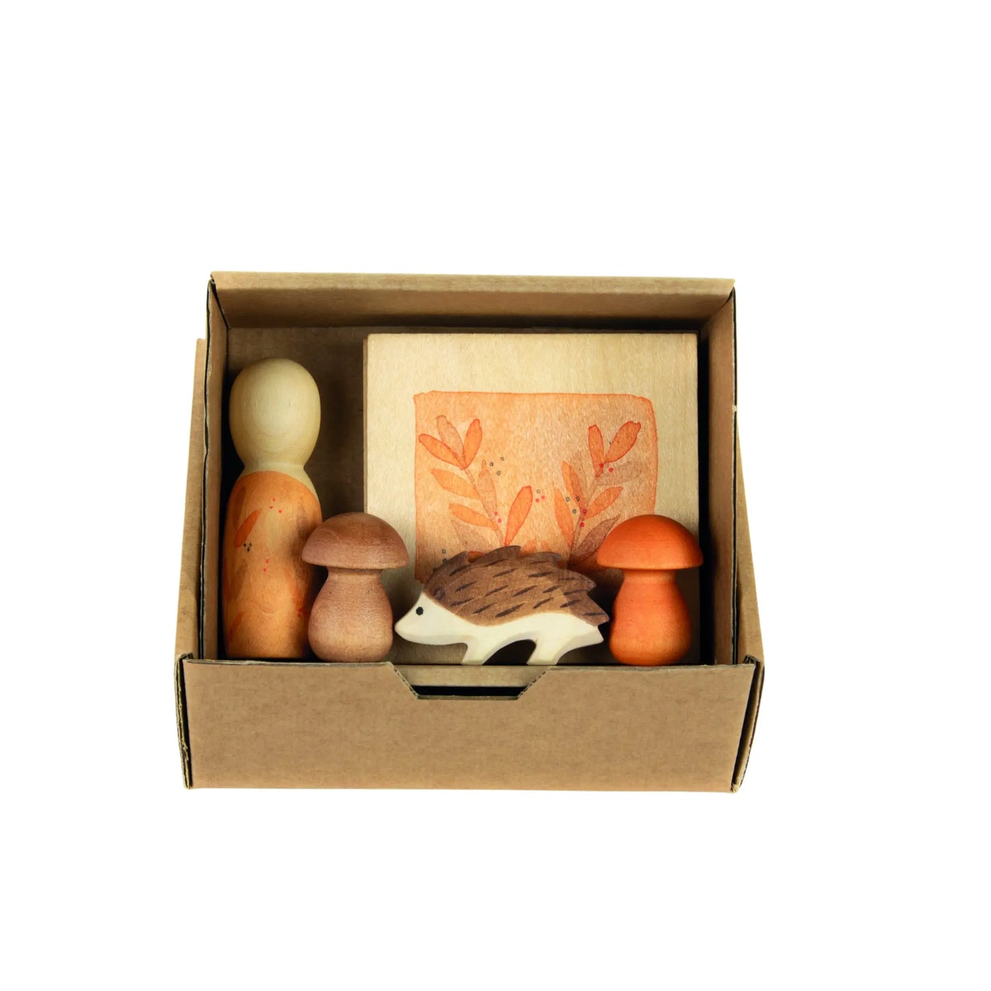 Set of Grapat and Ostheimer wooden toys including a hedgehog, mushrooms, and an egg in a cardboard box on a white background.