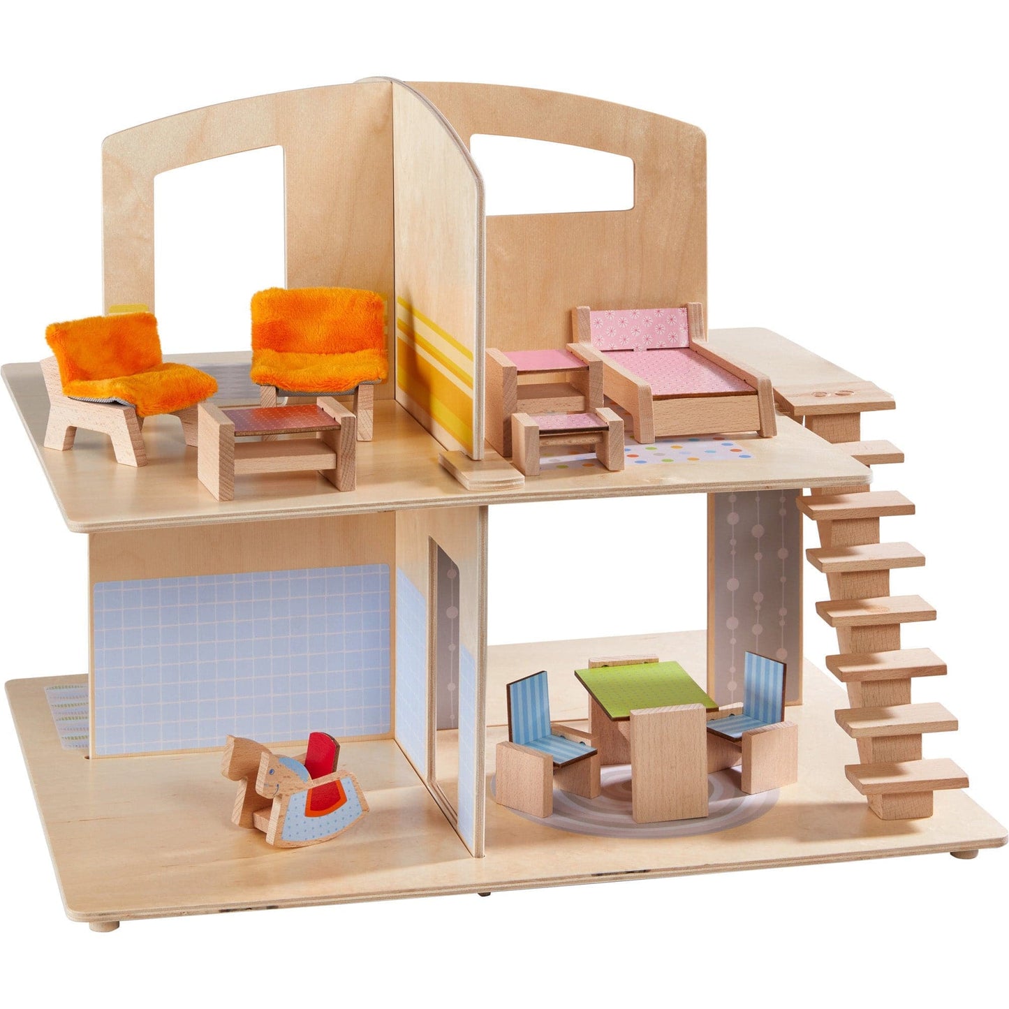 Wooden dollhouse with colorful furniture on a white background