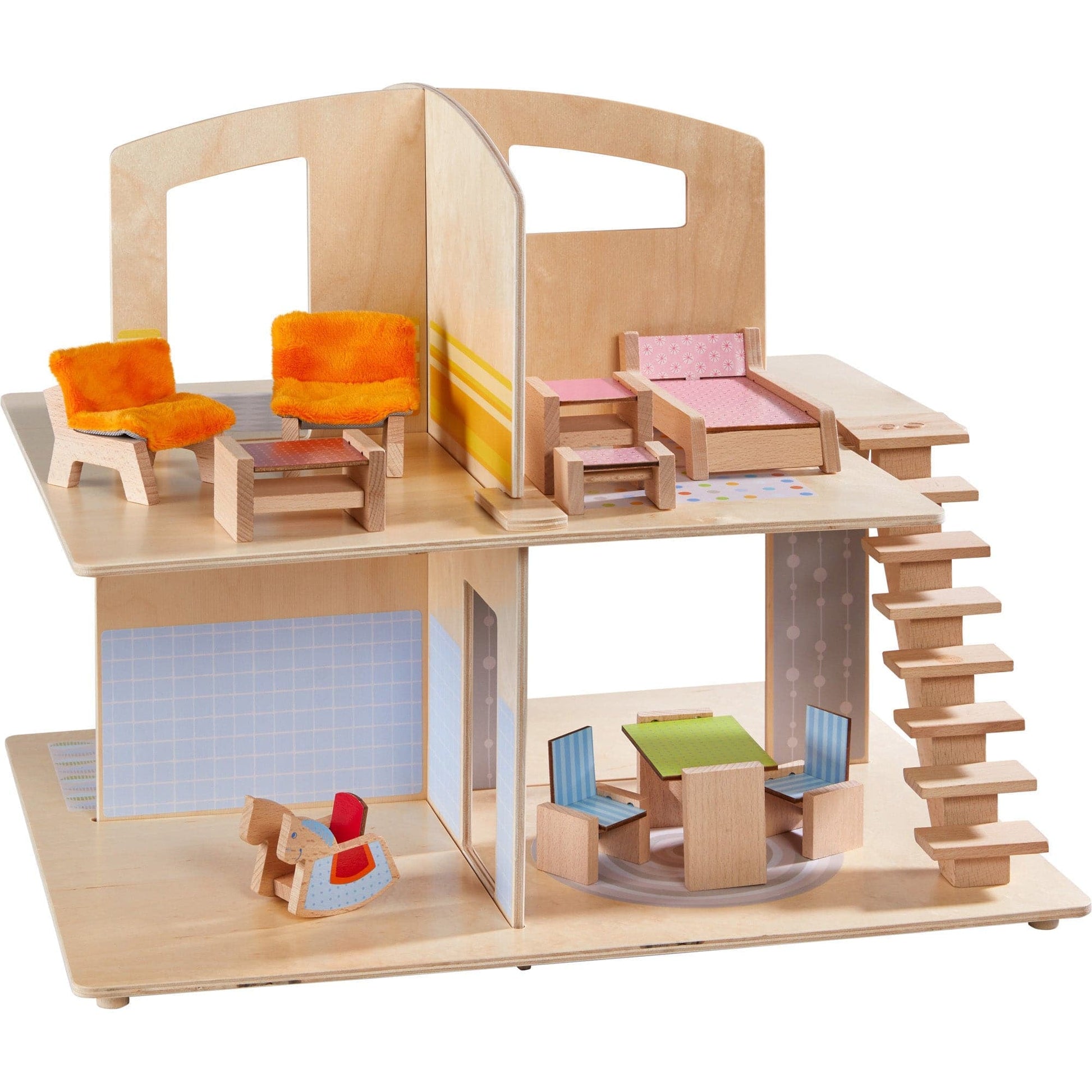 Wooden dollhouse with colorful furniture on a white background