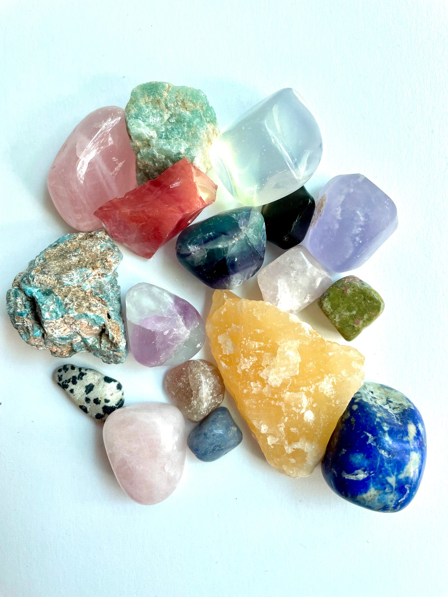 A variety of raw and polished rocks in various sizes