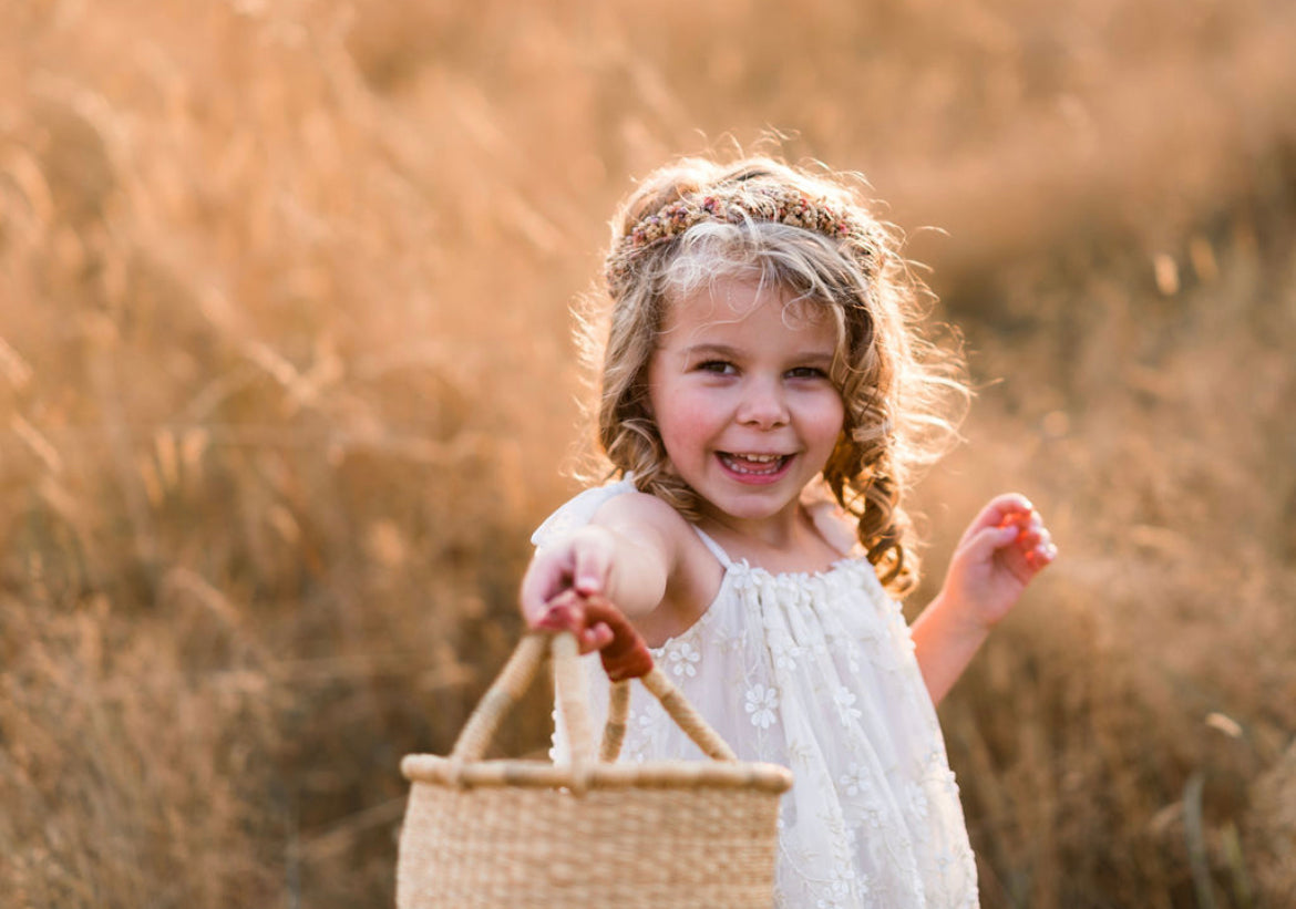Baby Bolga Basket and a preschool aged girl - Alder & Alouette