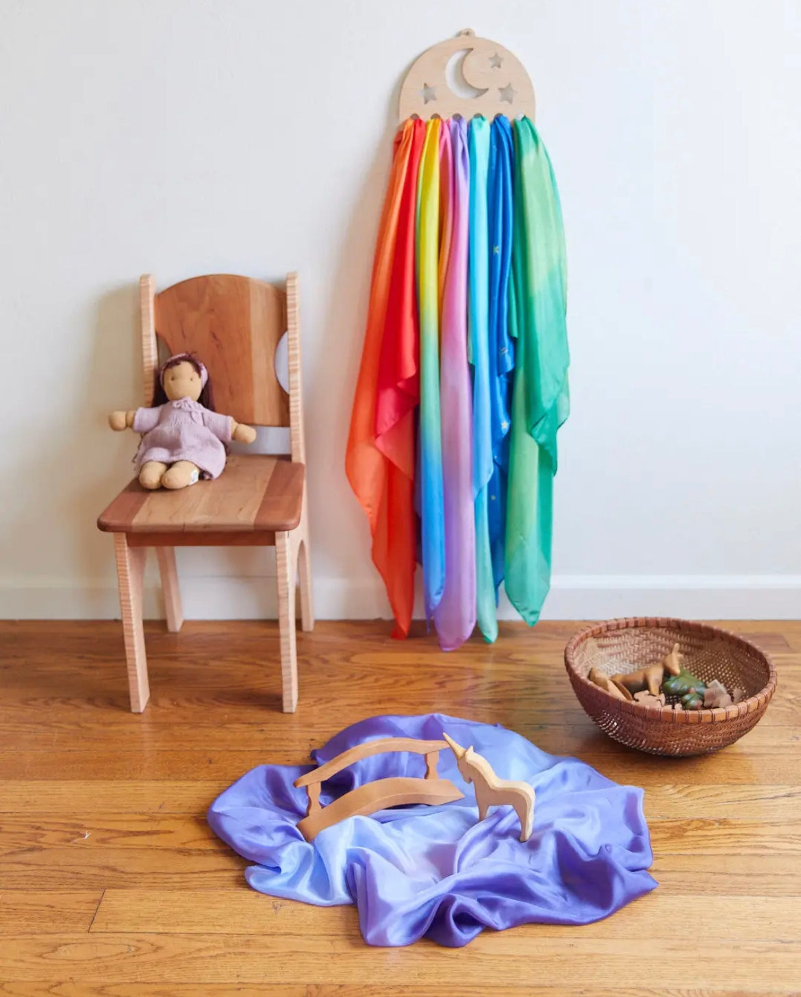Sarah's Silks Wooden Playsilk Holder Moon and Stars with doll and wooden toys on a playsilk