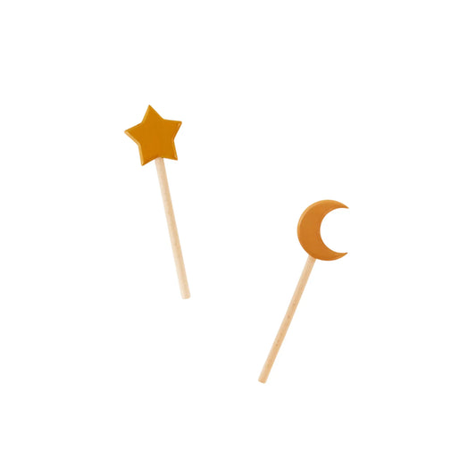 Two wooden kid's wands with star and moon shapes on a white background