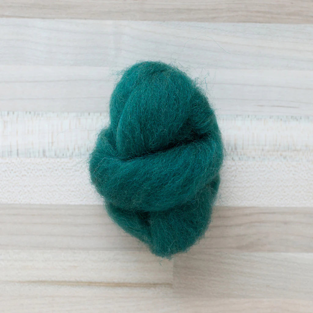 Pine Green Wool Roving Felter's Flowing on tabletop