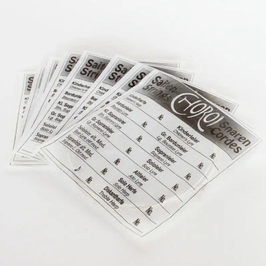 Several packages of Children’s Lyre 12-String Replacement Lyre Strings 
