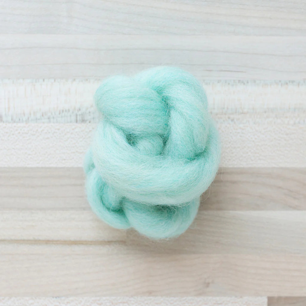 Spearmint Wool Roving Felter's Flowing on tabletop