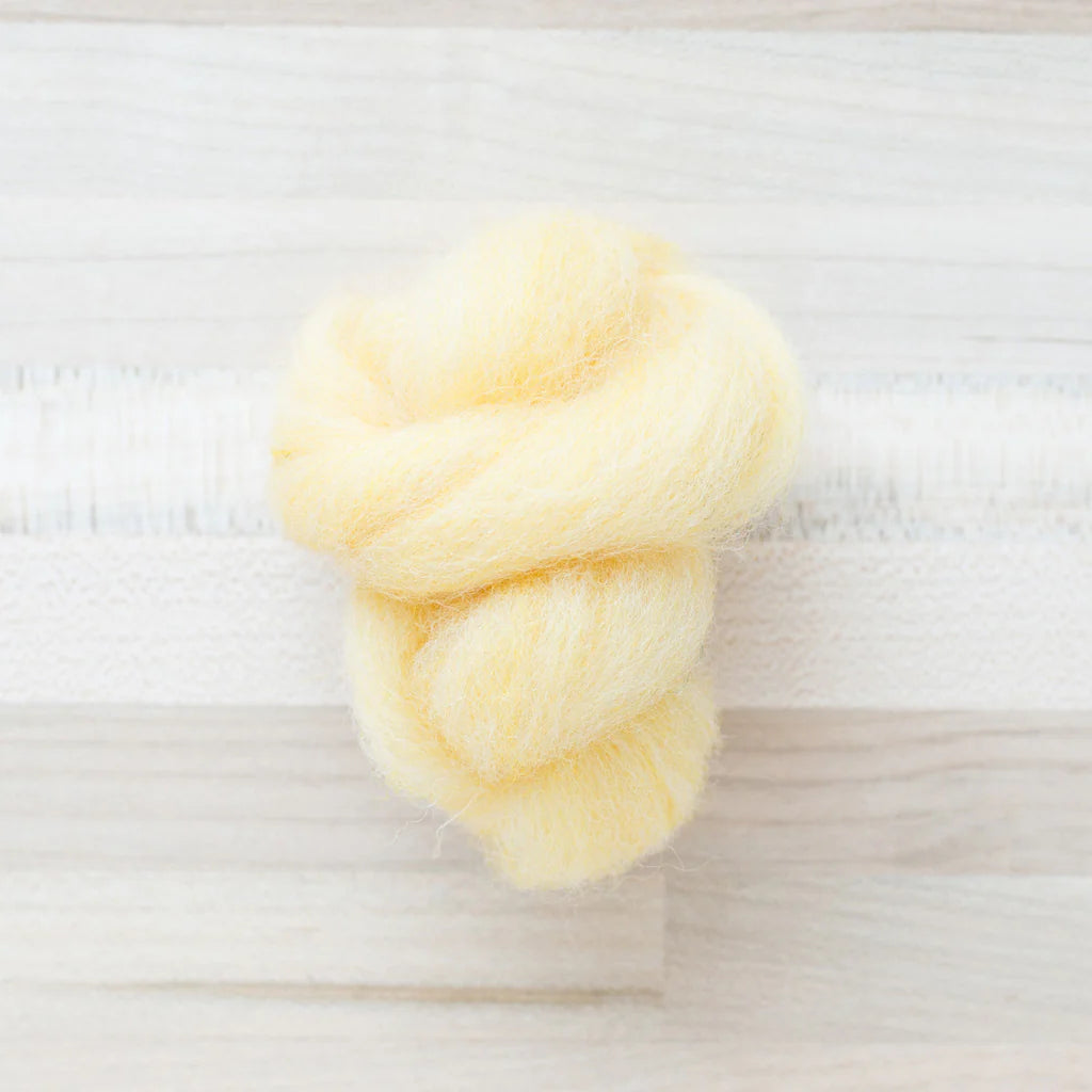 Sweet Corn Light Yellow Wool Roving Felter's Flowing on tabletop