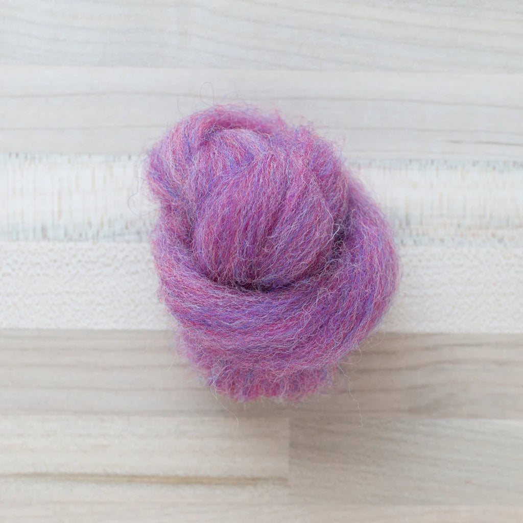 Aster Pink Wool Roving Felter's Flowing on tabletop