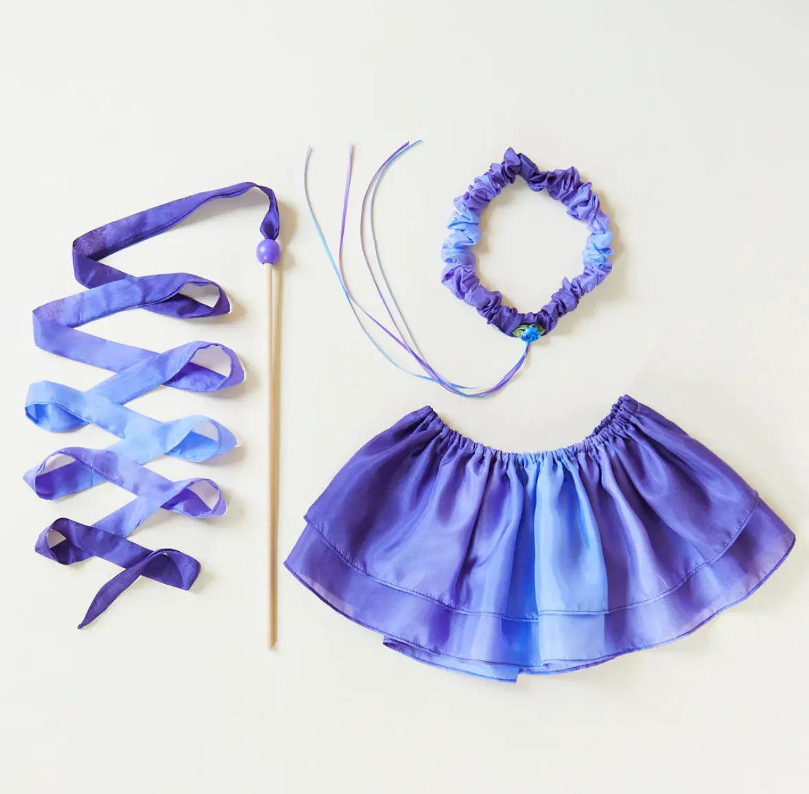 Butterfly silk Tutu with purple headband + skywriter wand toy, arranged for dress-up inspiration.