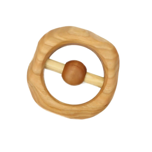 Wooden cherrywood baby rattle with a round handle on a white background