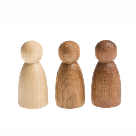 Three wooden Grapat peg dolls of different colors on a white background