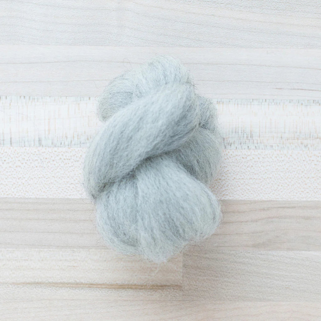 Gray Owl Wool Roving Felter's Flowing on tabletop