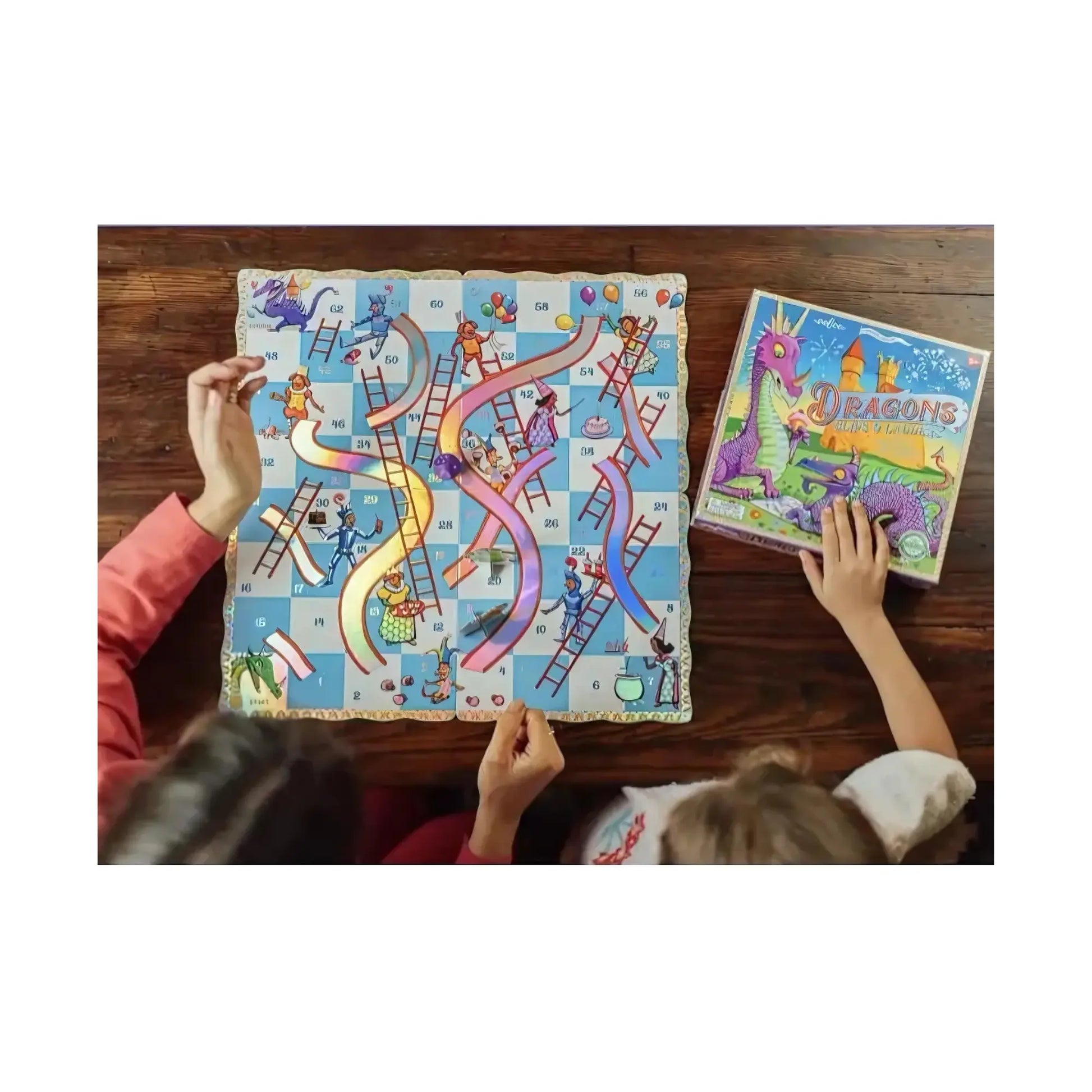 The Dragons slips and ladders board game on top of a wooden table with hands of two people